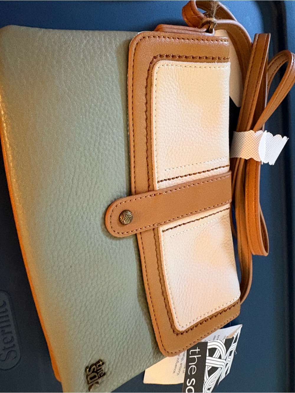 The Sak LOMA Two-Tone Crossbody in Sage Green, Tan, and Cream